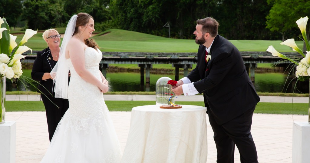 Tying the ribbons around the Bella Rose as part of the ceremony. (Photo by David and Vicki Photography)